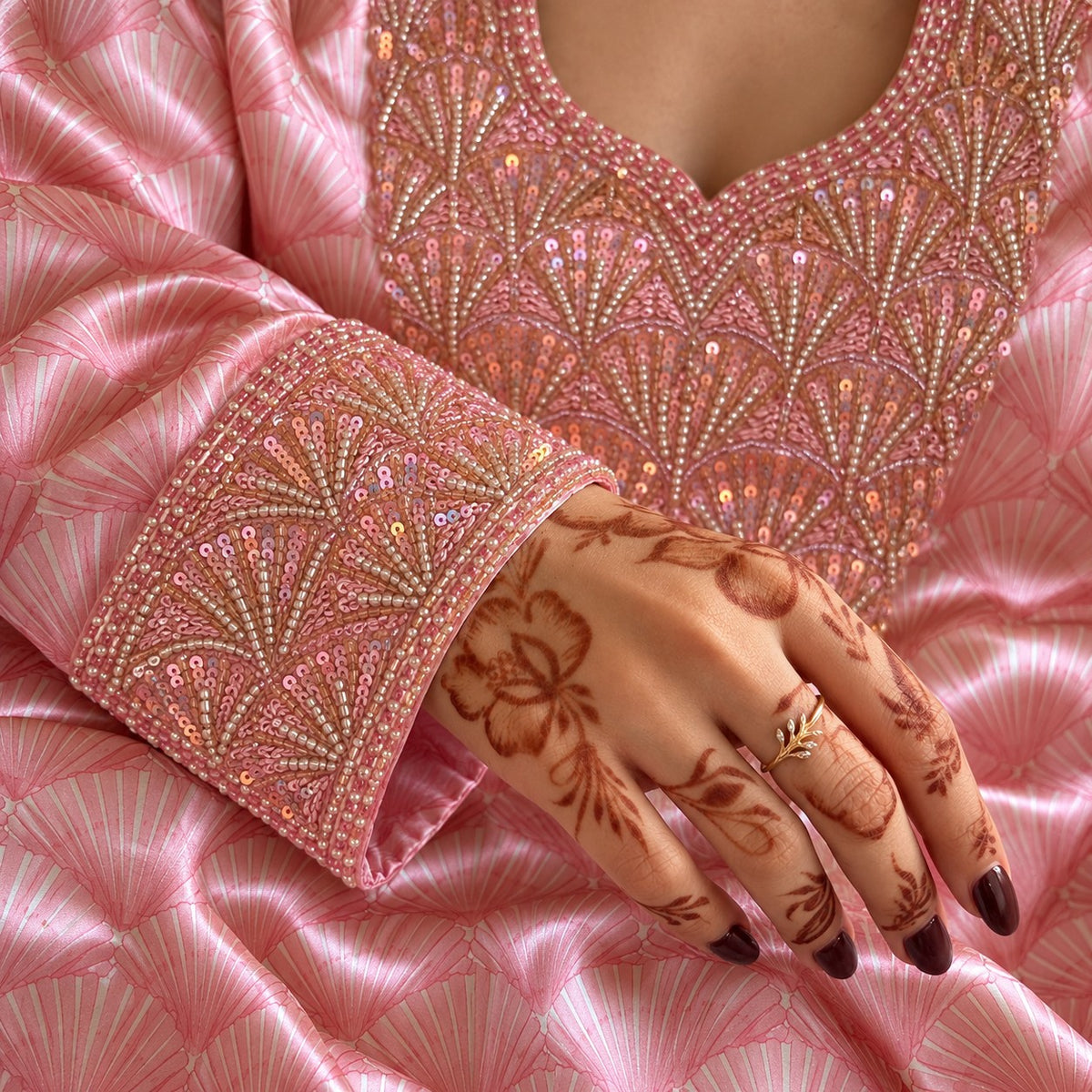 Close-up of the Blush cuff band in rose sequins and pearl-look beads