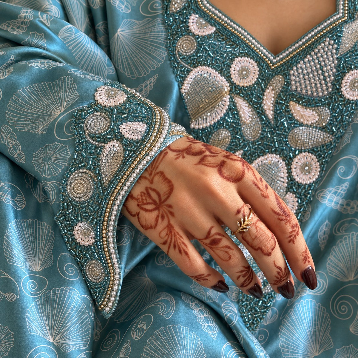 Close-up of the Ocean cuff in teal beading with pearl-look shells