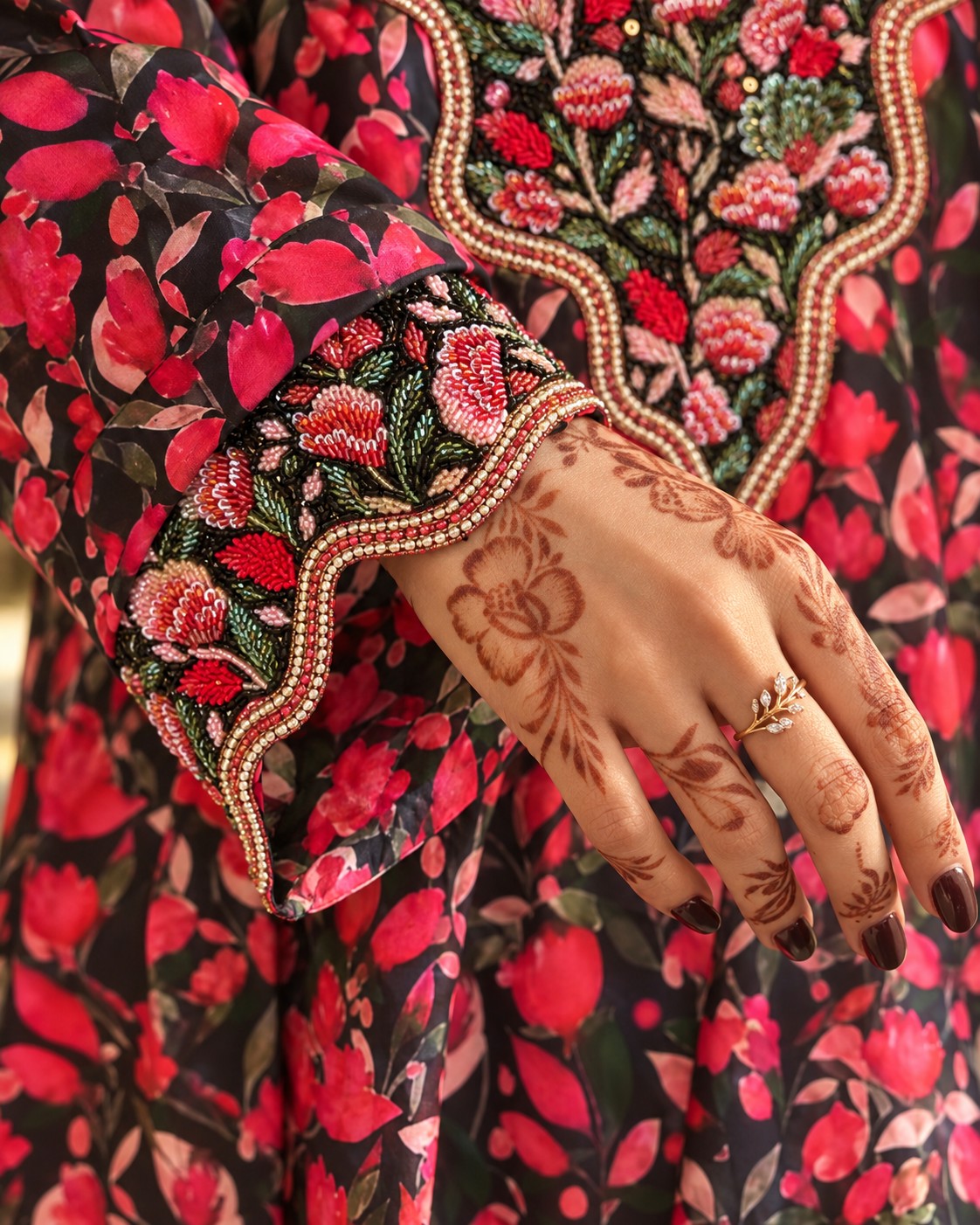 Close-up of the Zafran scalloped cuff with red and pink beaded roses
